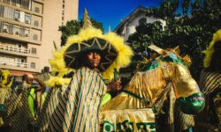 IMAGE SIX A young member of the Campos Caretta Fanti Carnival Troupe in an elaborate costume featuring a hat and a makeshift horse 2022 scaled 1